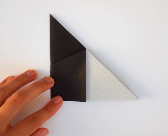 fold triangle in half bring left corner of the triangle underneath