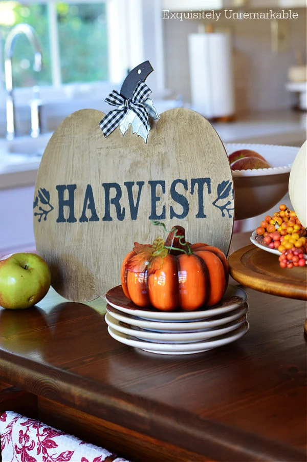 Harvest Pumpkin Sign On a table with pumpkins