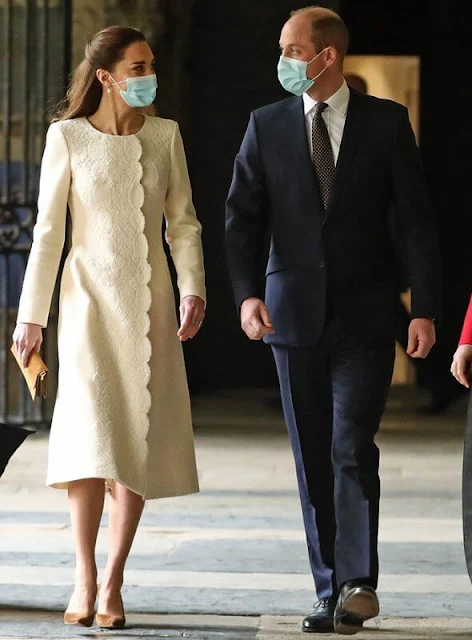 Kate Middleton wore a new lace embellishment wool coat from Catherine Walker. Annoushka pearl and Kiki diamond hoop earrings