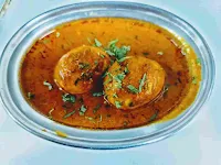 Serving Dhaba style egg curry