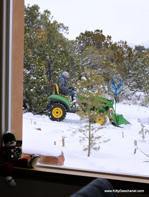 plowing the snow on a john deere tractor