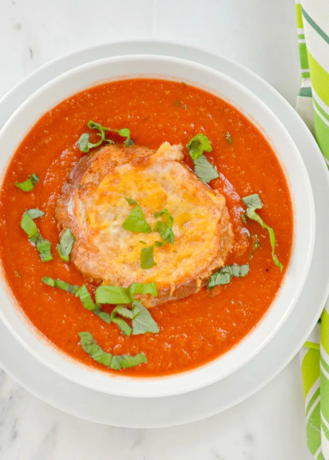 Homemade Tomato Basil Soup recipe with Cheesy bread is a quick easy dinner recipe in under 30 minutes from Serena Bakes Simply From Scratch.