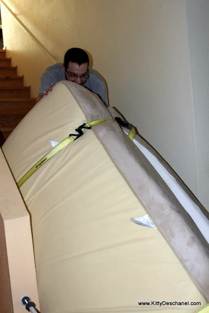 pushing the mattress down the stairs