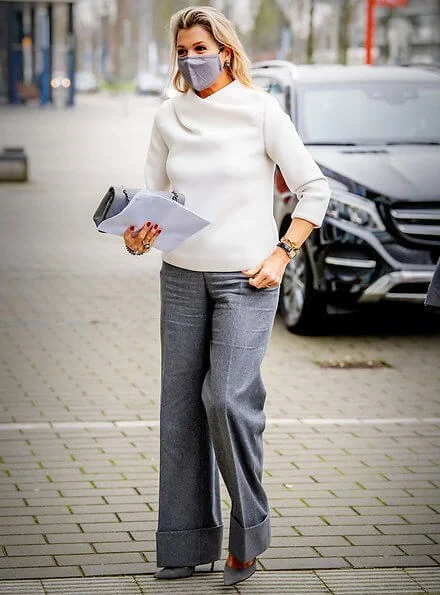 Queen Maxima wore a white silk top from Natan, and grey suede pumps from Gianvito Rossi, and the queen carried grey bag from Chanel