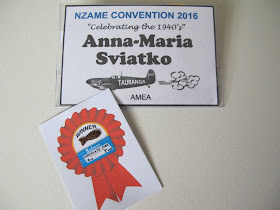 Name tag for NZAME convention 2016, with a tiny chocolate fish on a backing paper printed with a 'winner' rosette.