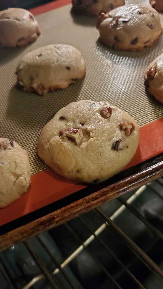 chocolate chip cookies baking in the oven