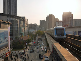 metro train arriving at Xunlimen Station in Wuhan