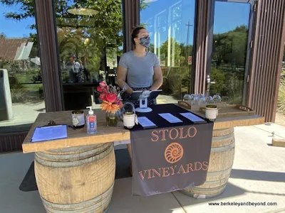 Katie at check-in desk at Stolo Family Vineyards in Cambria, California