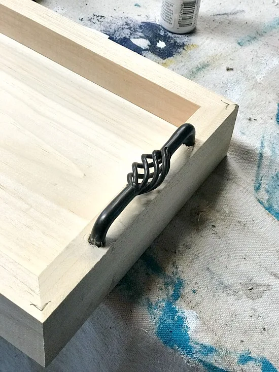 Rustic tray with cabinet handles and a lakehouse rental stencil