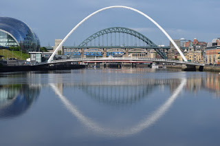 A reflection in the River Tyne of the Millennium and Tyne bridges