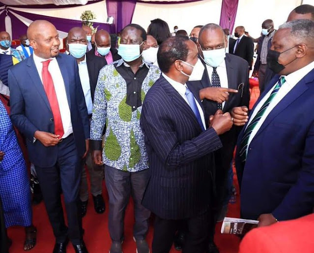 Gatundu South MP Moses Kuria with Raila Odinga photo
