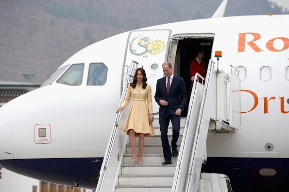 Prince William, Duke of Cambridge and Catherine, Duchess of Cambridge arrive into Paro International Airport for the first day of a two day visit to Bhutan. Kate wore Emilia Wickstead soft-yellow gold bespoke coatdress