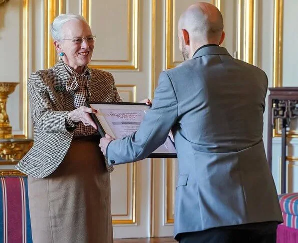 Queen Margrethe II of Denmark. Chief physician Ellen-Margrethe Hauge and Aalborg University Hospital clinical assistant  Rasmus Westermann