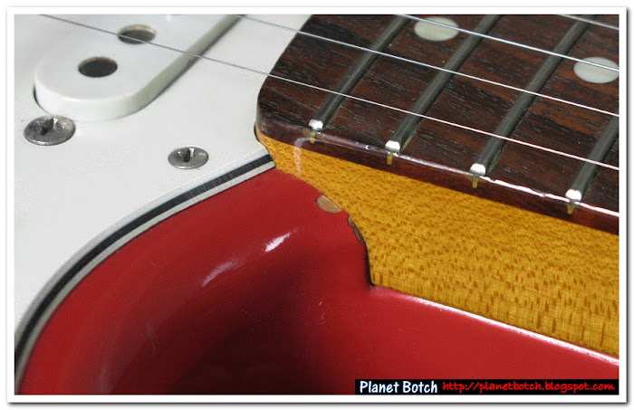 Strat neck join showing chipped body paint, suggesting a wider neck may have been forced into the pocket