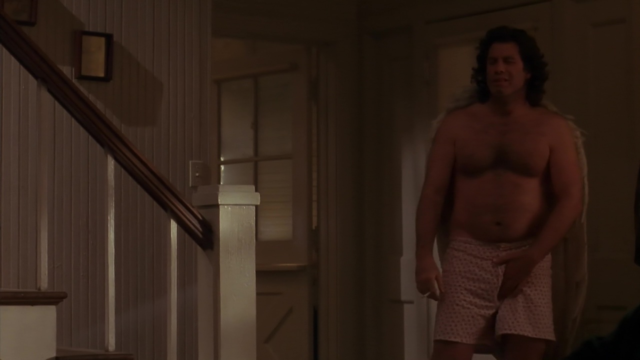 John Travolta shirtless in Michael.