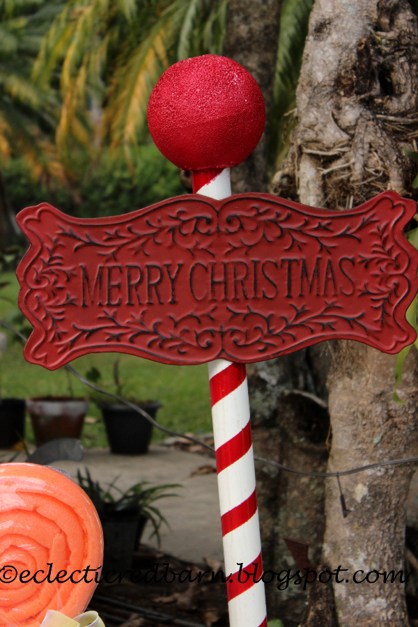Eclectic Red Barn Christmas sign attached to PVC pole