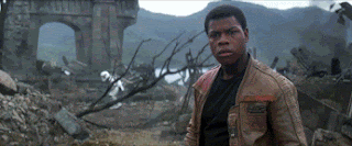 A Star Wars gif, with a young black man fighting a giant candy cane man with a candy cane light saber.