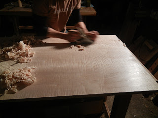 Matthew Wolfe Furniture Maker hand planing a curly maple tiger maple desk top
