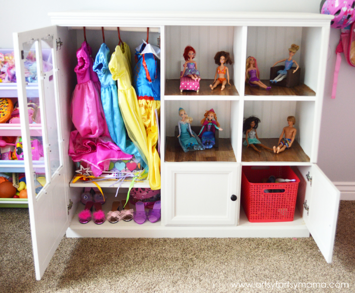 Entertainment Center to DIY Dollhouse and Dress-Up Cabinet from artsyfartsymama.com #upcycle #dollhouse #Barbiehouse