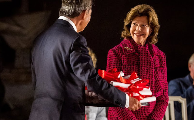 Queen Silvia of Sweden wore a red wool jacket and skirt