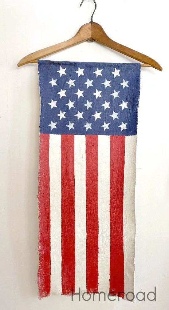 Red white and blue vertical American flag on hanger