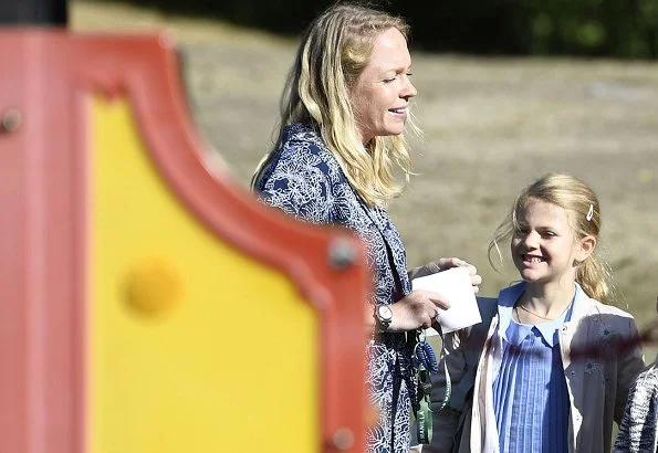 Crown Princess Victoria is wearing Baum und Pferdgarten skirt and blouse. Princess Estelle on the first school day