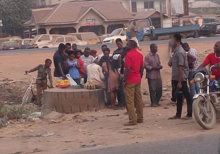 Unbelievable! People Gather Around Mad Woman in Aba to Get Lucky Betting Numbers (Photos)