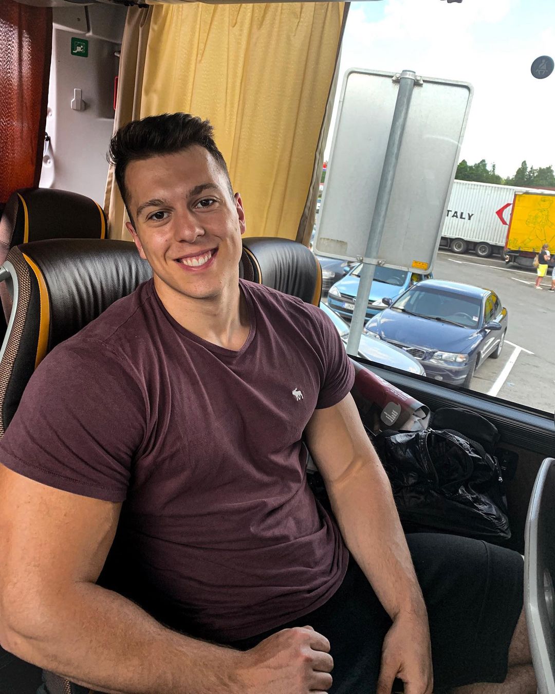 cute-fit-young-tall-guy-on-the-bus-paul-unterleitner-smiling