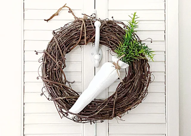 white stuffed carrot on a grapevine wreath