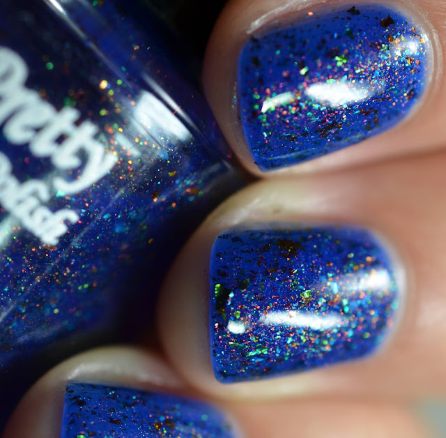 ocean blue nail polish with shimmer and tiny holographic flakes