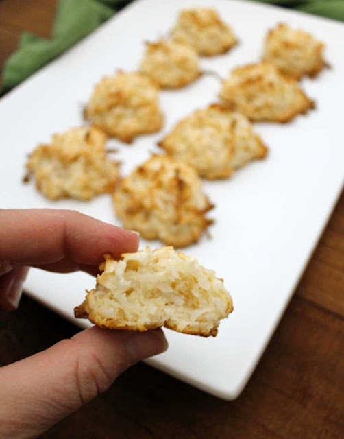 Chewy coconut filled macaroons are a simple cookie to make. The batter is super simple to make and the goodness of sweetened condensed milk is baked right in! close up of inside of a coconut macaroon