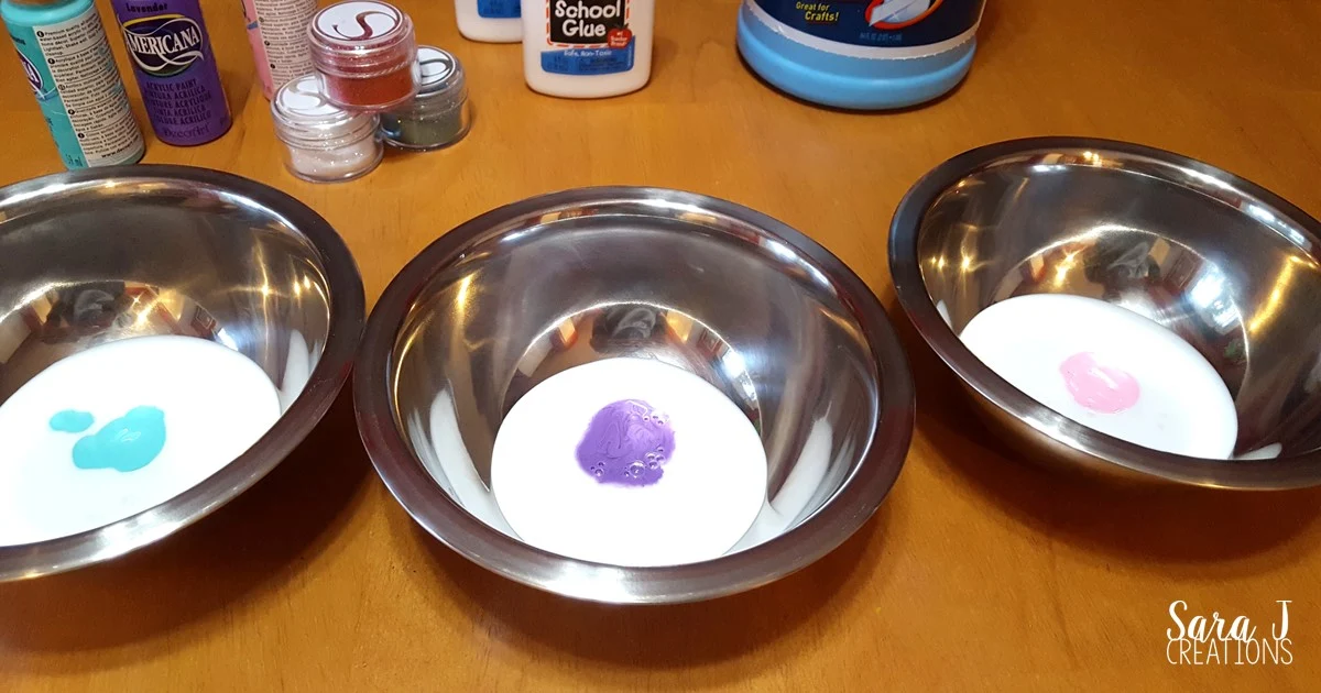 Troll inspired slime recipe.  Make your own homemade slime with troll colors and glitter for an extra sparkle.