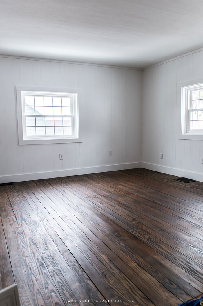 Stained floors and white painted paneling