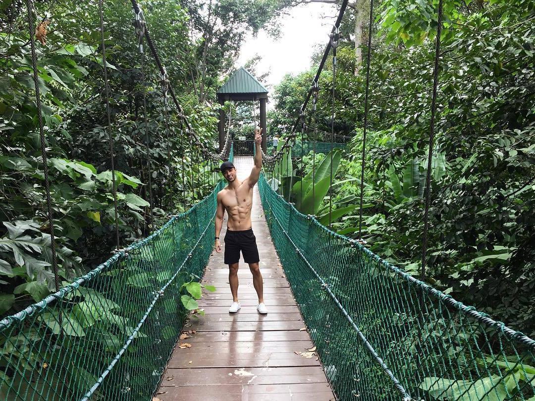 shirtless-fit-dude-sixpack-abs-smiling-walking-nature-cool-hidden-mini-bridge-forest