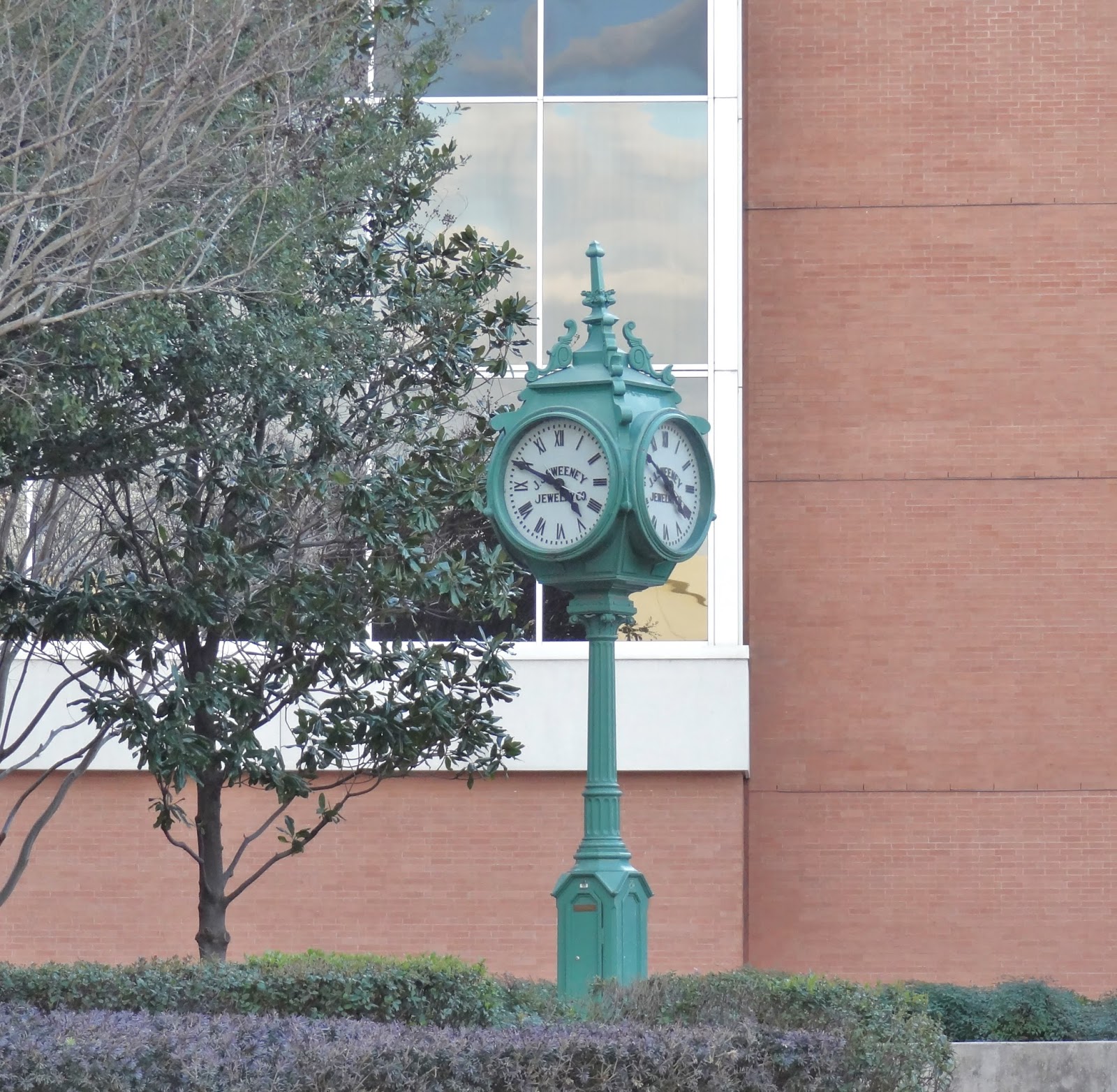 Houston in Pics Sweeney Clock (1908) in small park at the Theater Dist