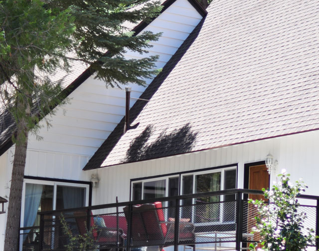 classic white house with black trim and brick