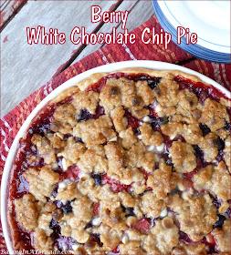Berry White Chocolate Chip Pie features berries, baked into a pie crust topped with a white chocolate chip crumble. | Recipe developed by www.BakingInATornado.com | #recipe #dessert