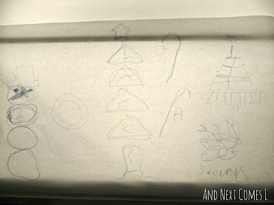 A preschooler's completed tracing of Christmas shapes from And Next Comes L