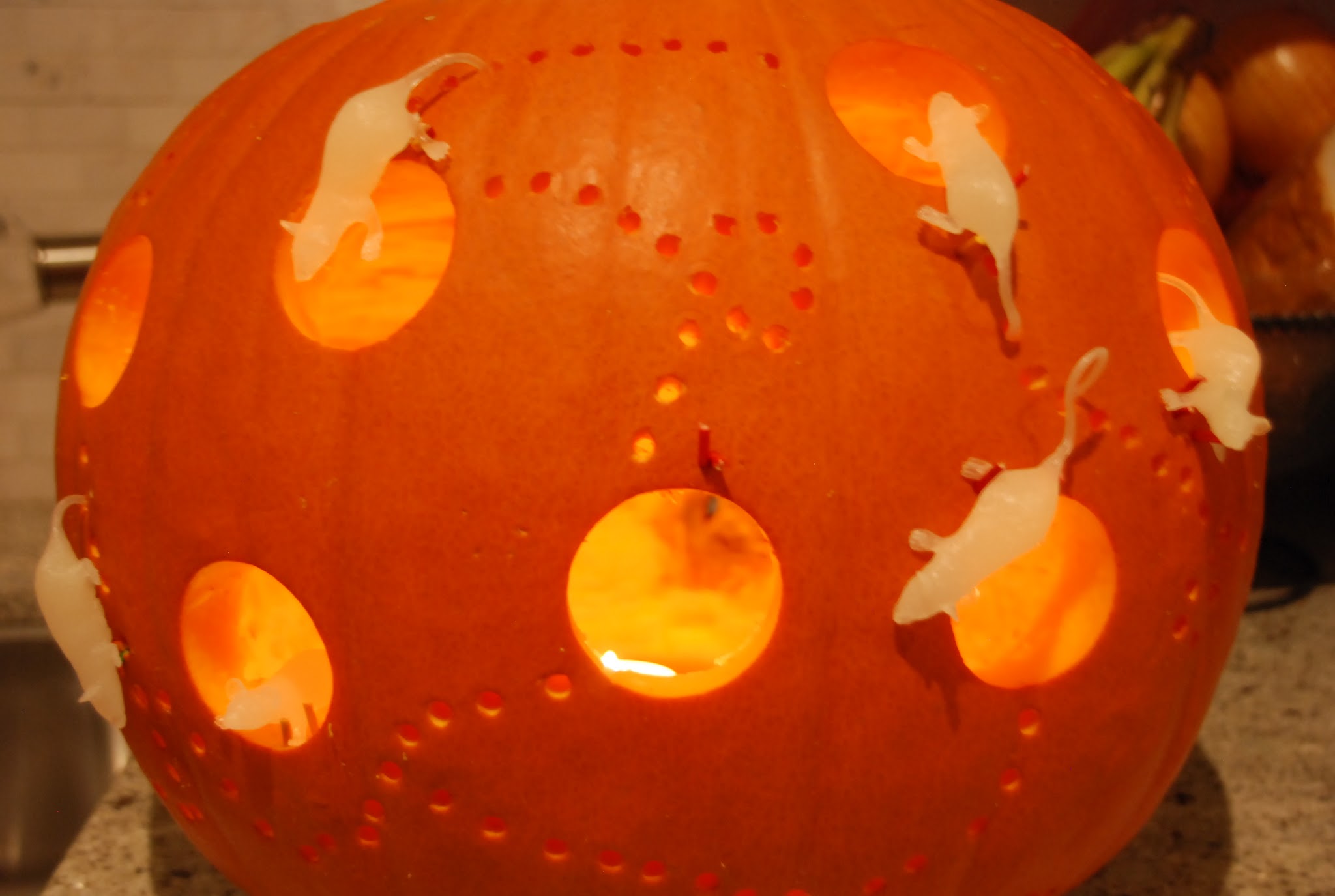 pumpkin with drilled holes, pumpkin mouse house, power tool pumpkin DIY, pumpkin with glow in dark mice