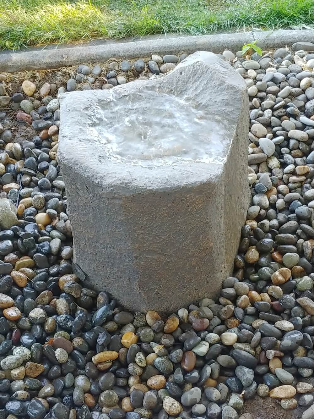 add rocks to cover the fountain basin