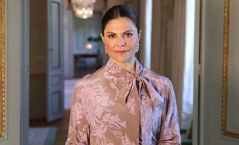 Crown Princess Victoria wore a floral-jacquard dress from Acne Studios, and rose gold poppy earrings with diamonds from Kreuger Jewellery