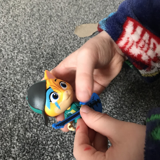 Child's hands holding the Lampo character