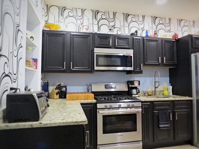 painted black kitchen cabinets with Cabinet Transformations kit