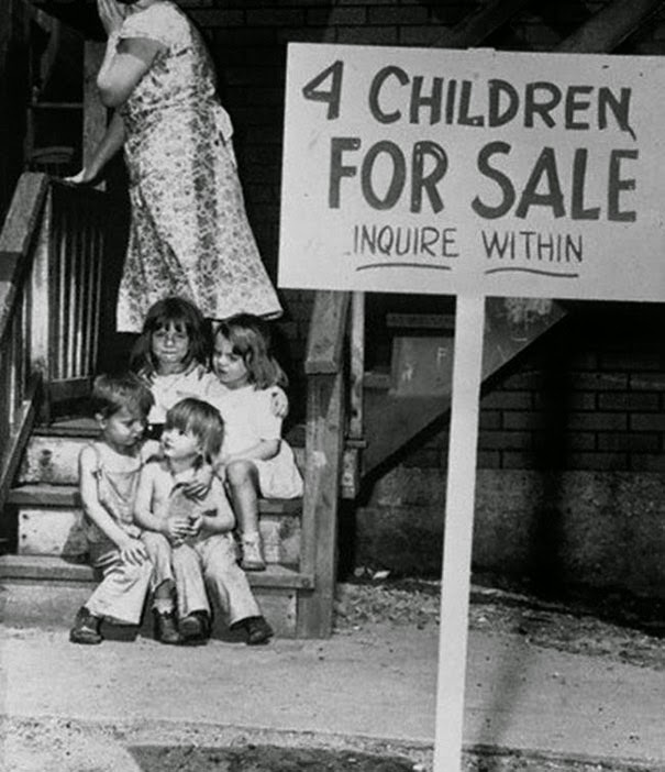 40 Must-See Photos Of The Past - Mother hides her face in shame after putting her children up for sale, Chicago, 1948