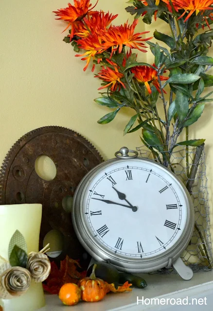 Fall floral decor and a clock.