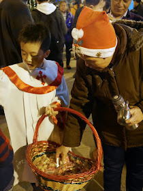 boy handing out candies