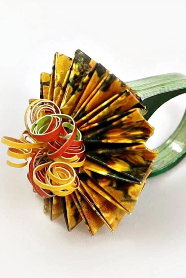 origami and rolled paper ring made of yellow floral paper