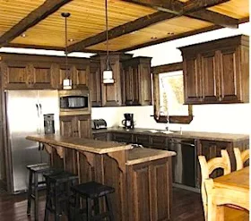Cottage kitchen with wood ceiling beams.