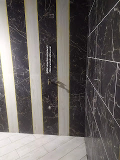 Small bathroom tile design with black and white tiles