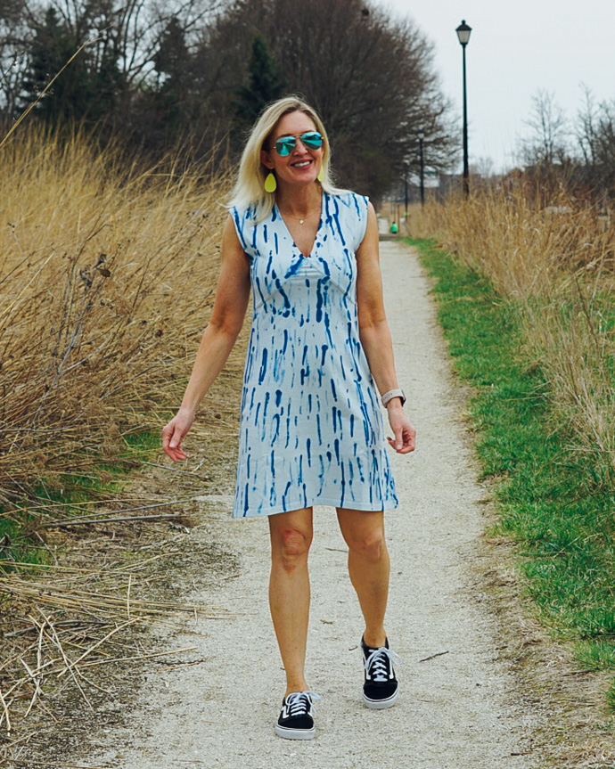 blue tie dye dress and Van's sneakers